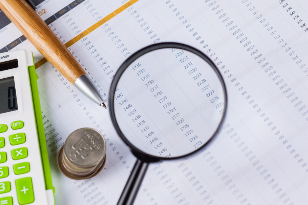 Calculator and magnifying glass on the table